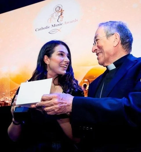 Mariana receiving recognition at the Catholic Music Awards
