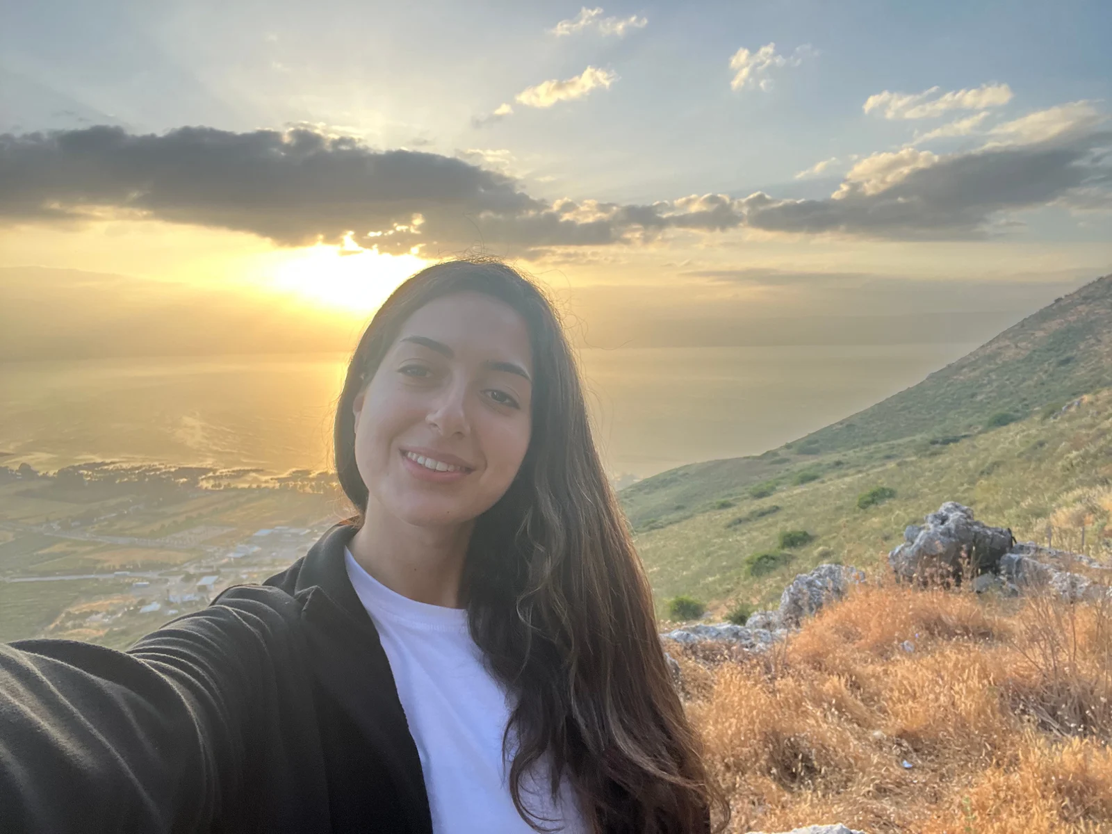 Mariana smiling above the Sea of Galilee at sunset